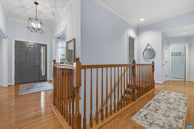 a dining room with furniture and chandelier