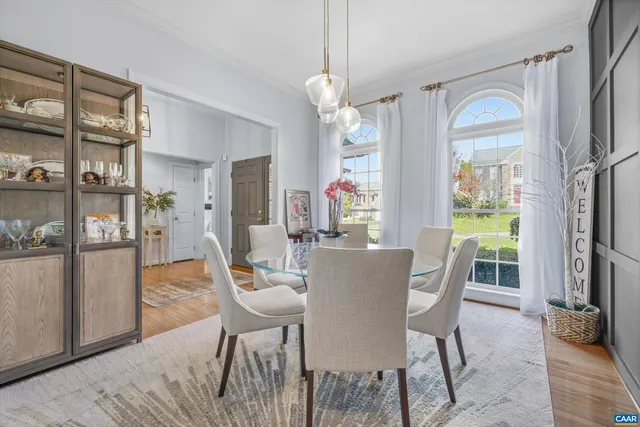 a large bed in a bedroom with a bed and a mirror