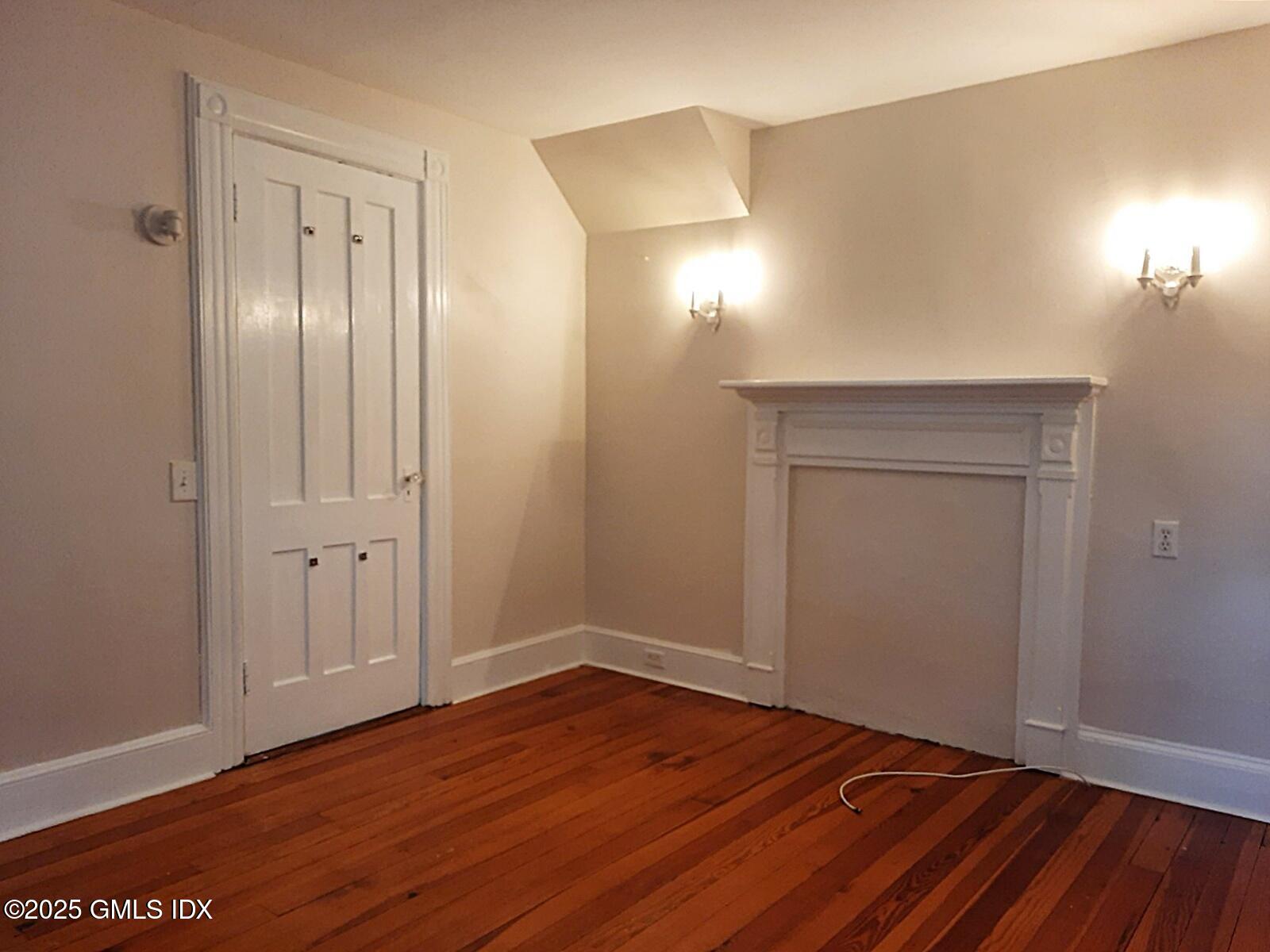 55 Valley Road Cos Cob, CT 06807 - Photo 13 of 21 a view of an empty room with wooden floor and a window
