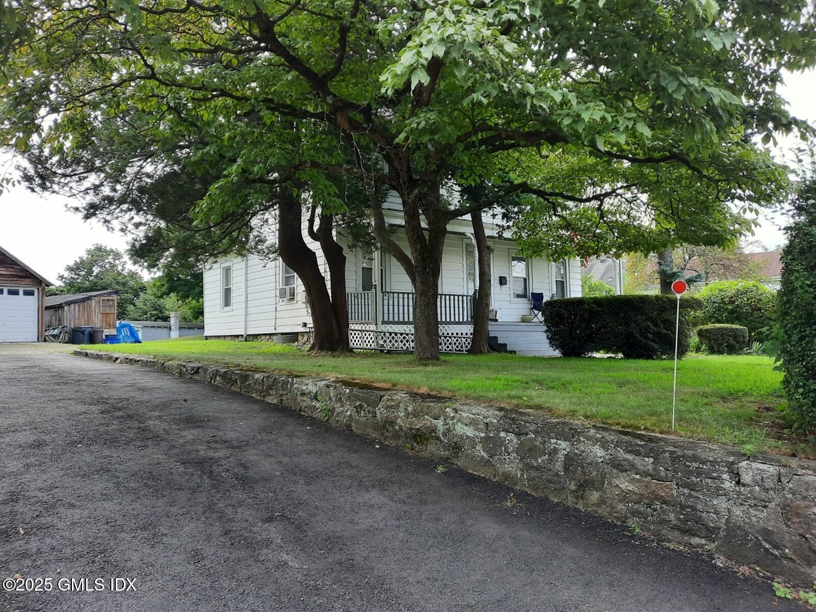 55 Valley Road Cos Cob, CT 06807 - Photo 3 of 21 a view of backyard of house with green space