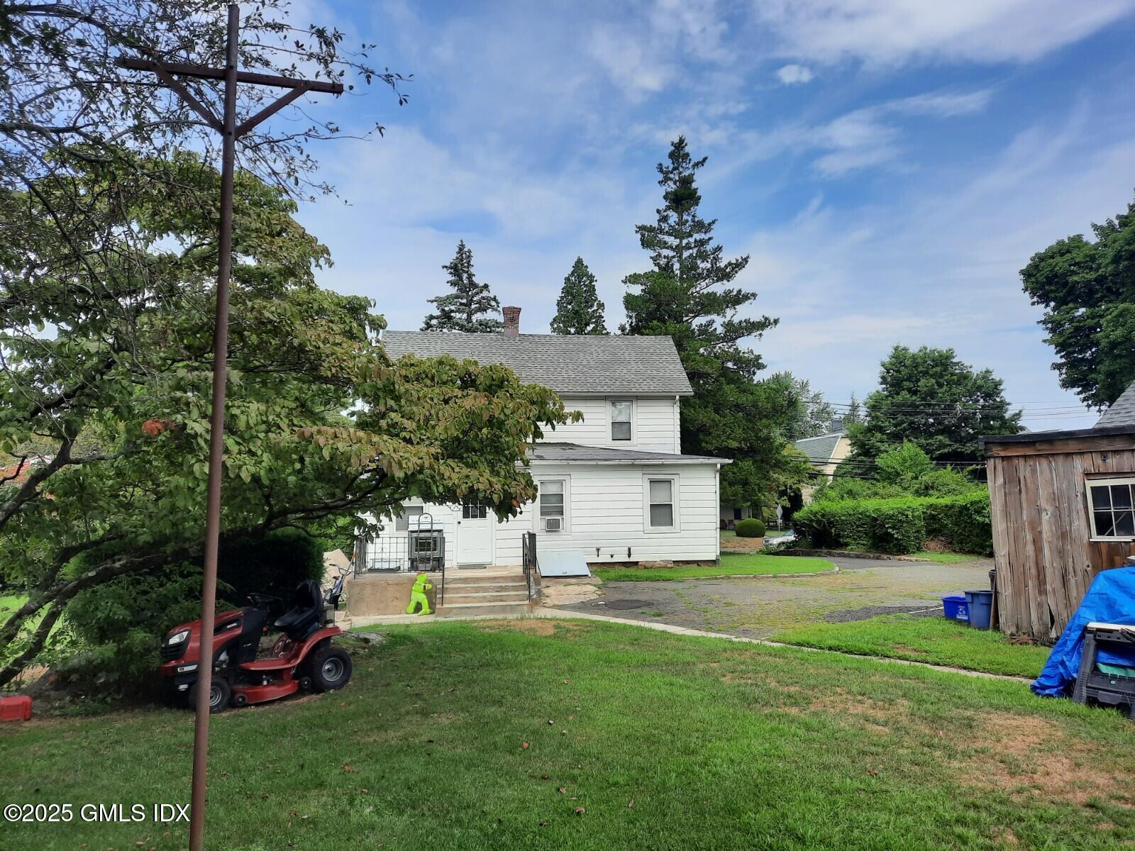 55 Valley Road Cos Cob, CT 06807 - Photo 4 of 21 a view of a house with a yard