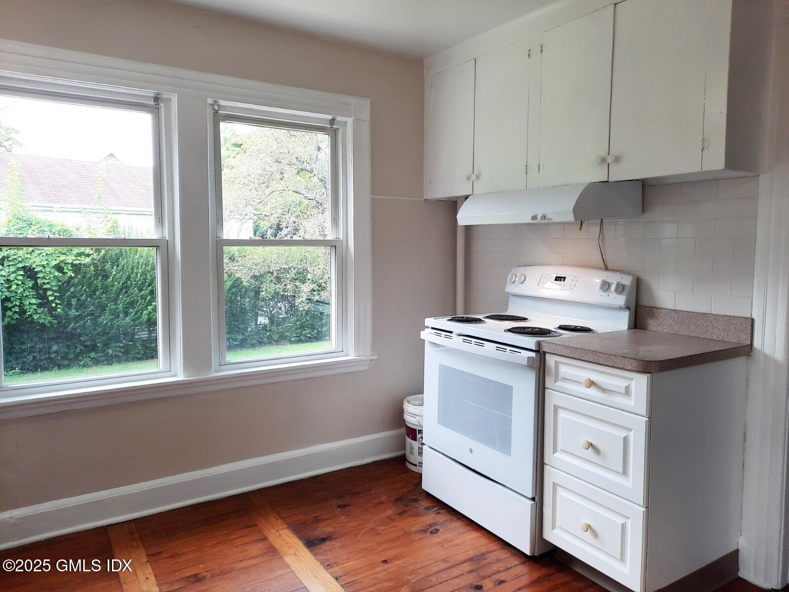 55 Valley Road Cos Cob, CT 06807 - Photo 6 of 21 a white stove top oven sitting inside of a kitchen