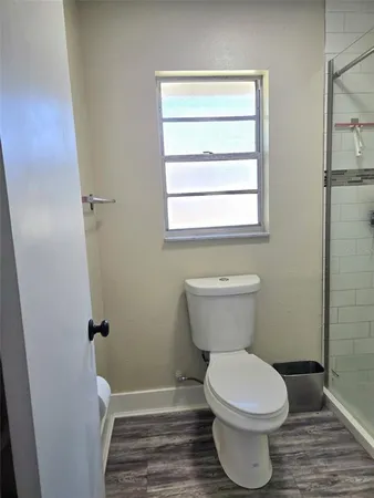 a bathroom with a toilet and a sink