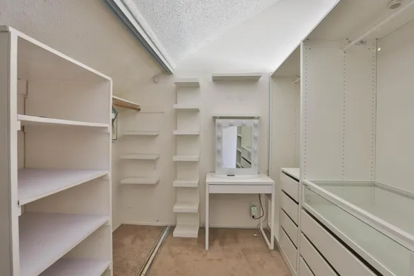 a view of an empty walk in closet