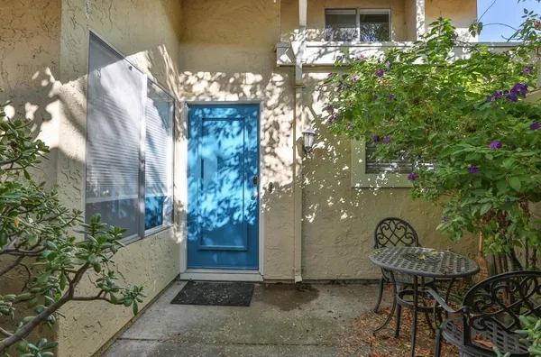a front view of a house with table and chairs