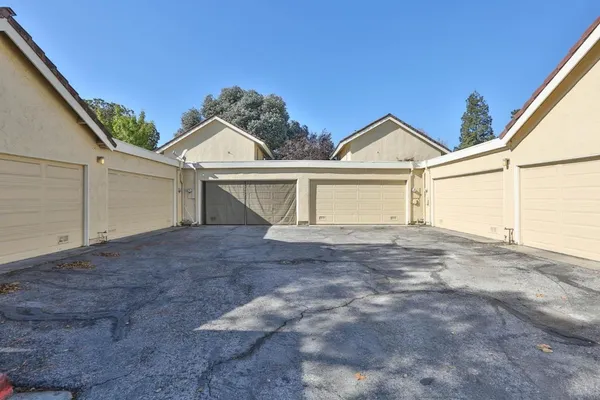 a view of a house with a yard and garage