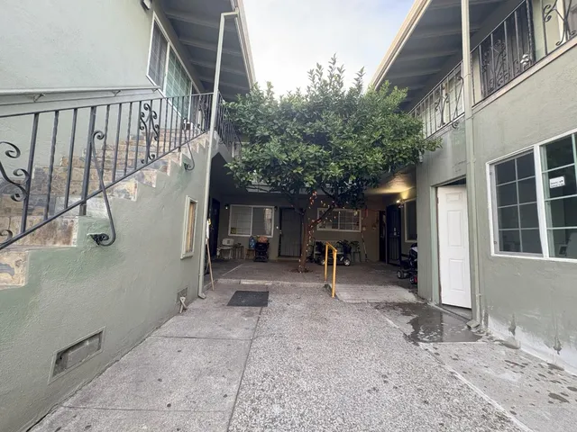 a view of a street from a hallway