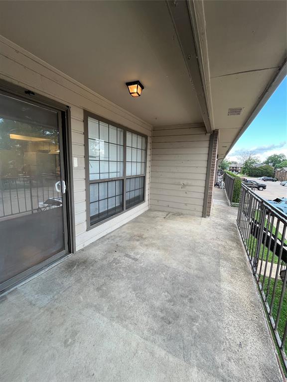 4460 Chaha Road, Unit 205 Garland, TX 75043 - Photo 26 of 27 a view of an empty room with wooden floor