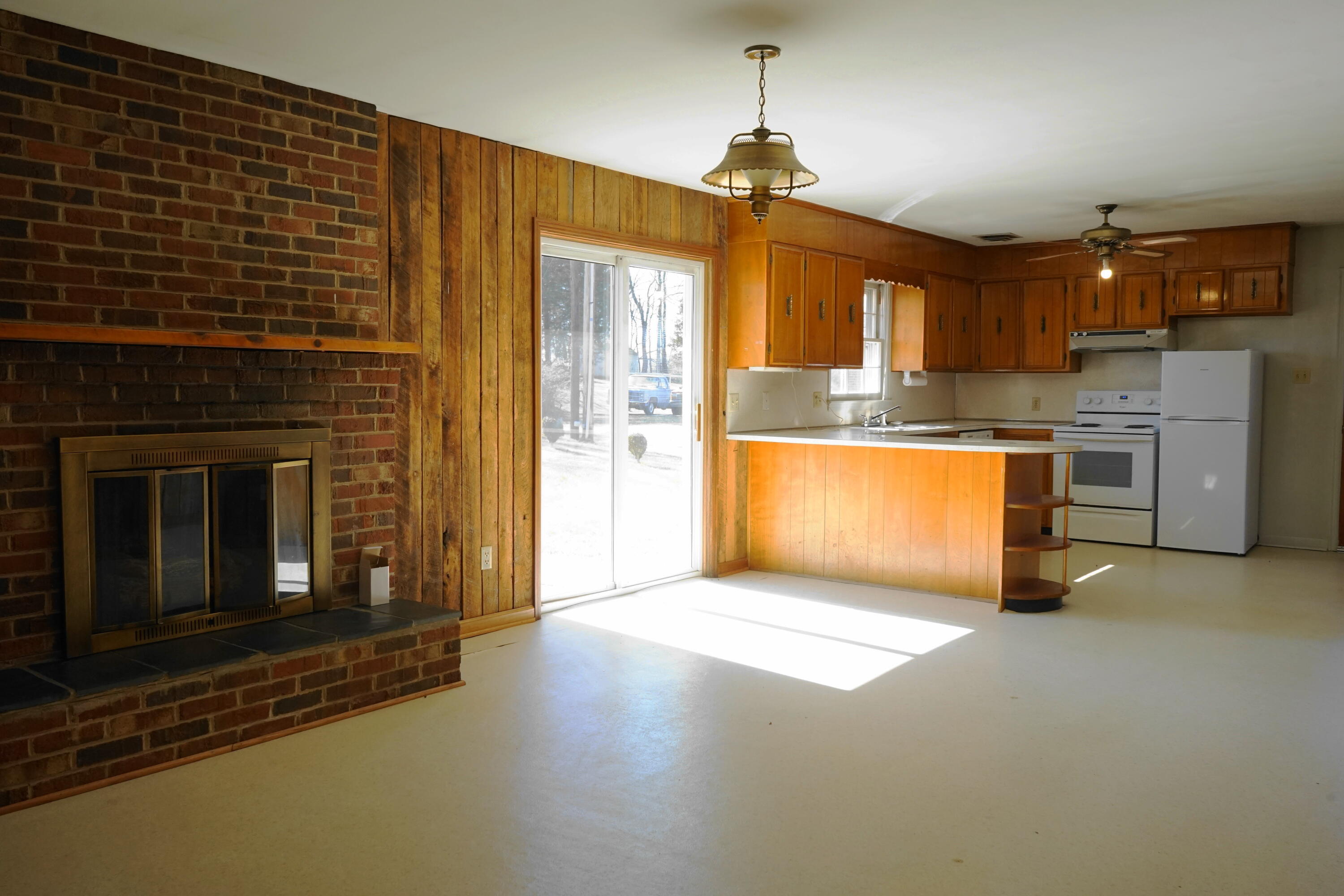 2231 Hardy Road Vinton, VA 24179 - Photo 19 of 38 a view of a kitchen with a sink and a fireplace