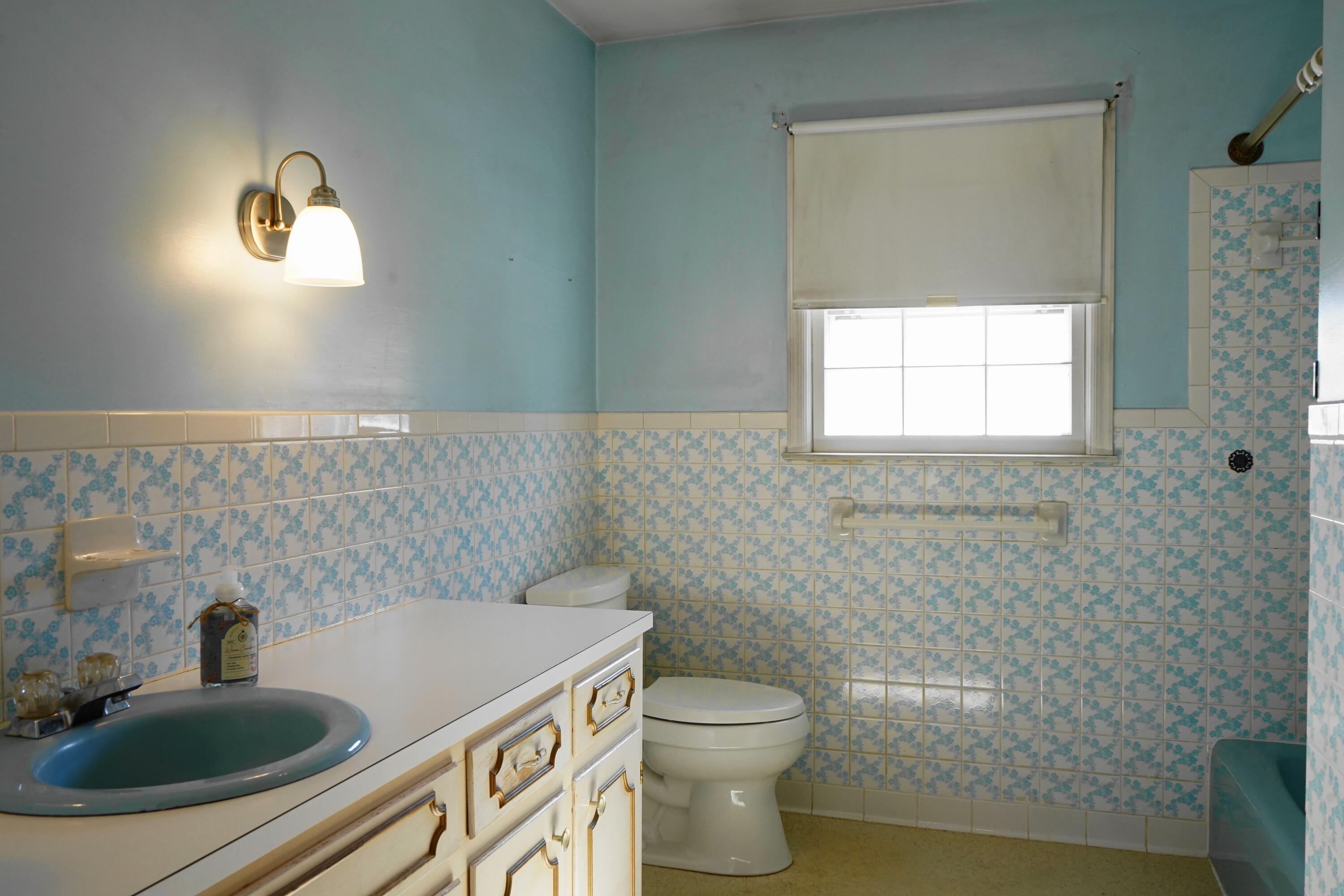 2231 Hardy Road Vinton, VA 24179 - Photo 23 of 38 a bathroom with a sink a toilet and a window