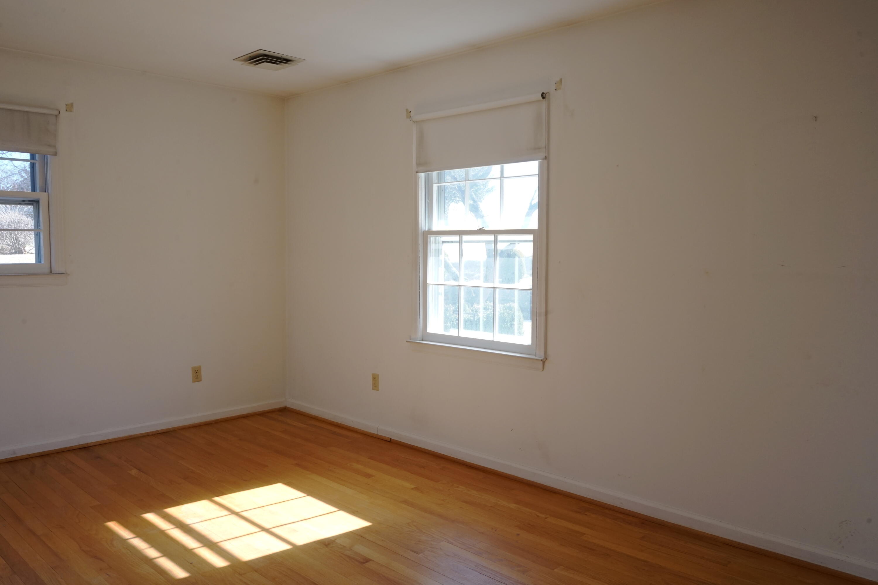 2231 Hardy Road Vinton, VA 24179 - Photo 26 of 38 an empty room with wooden floor and windows