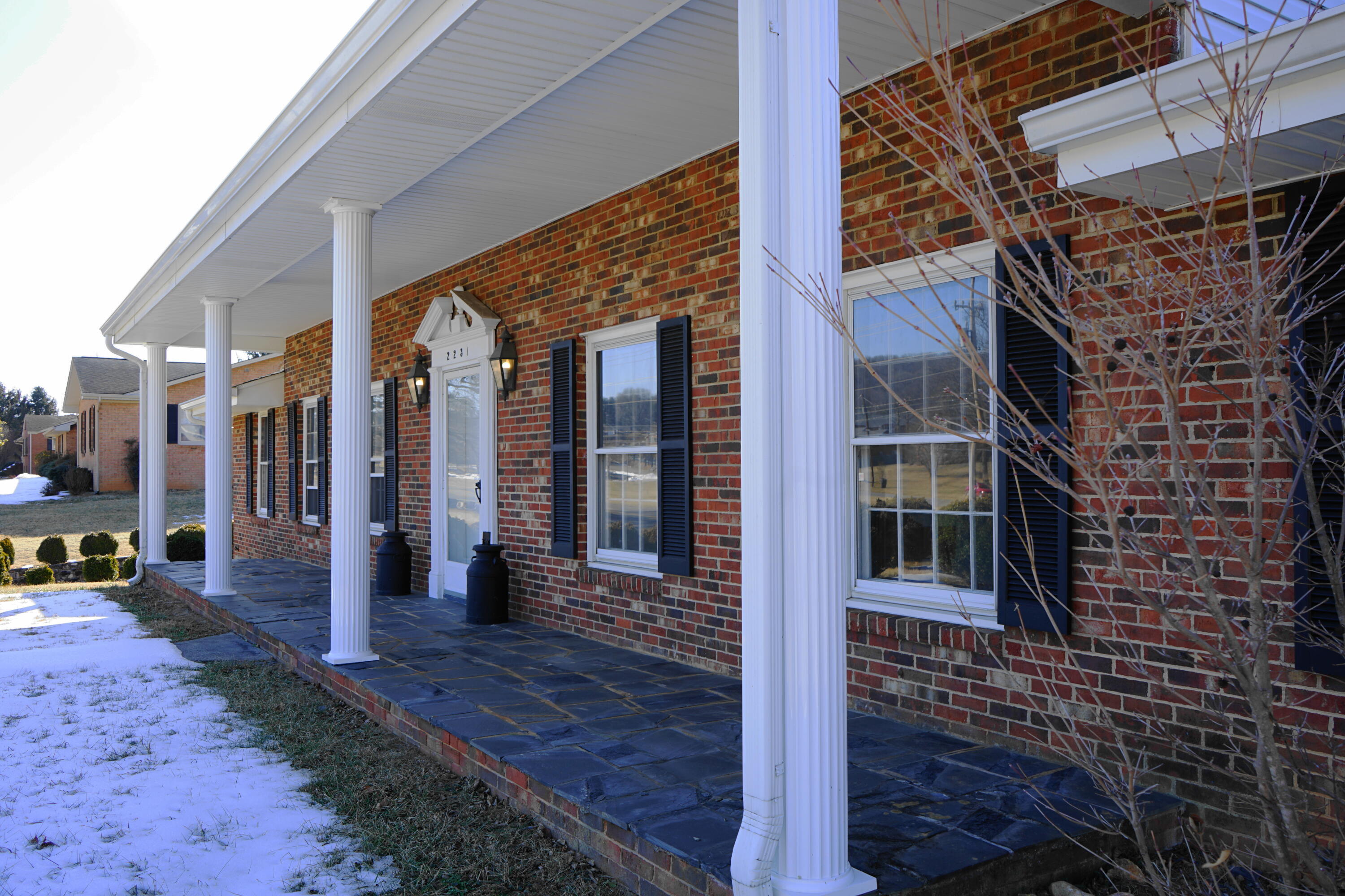 2231 Hardy Road Vinton, VA 24179 - Photo 9 of 38 a view of a brick house with large windows