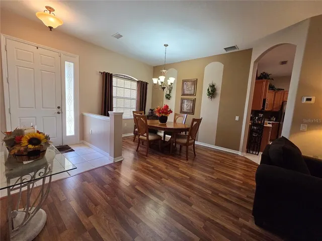 a living room with fireplace furniture and a wooden floor