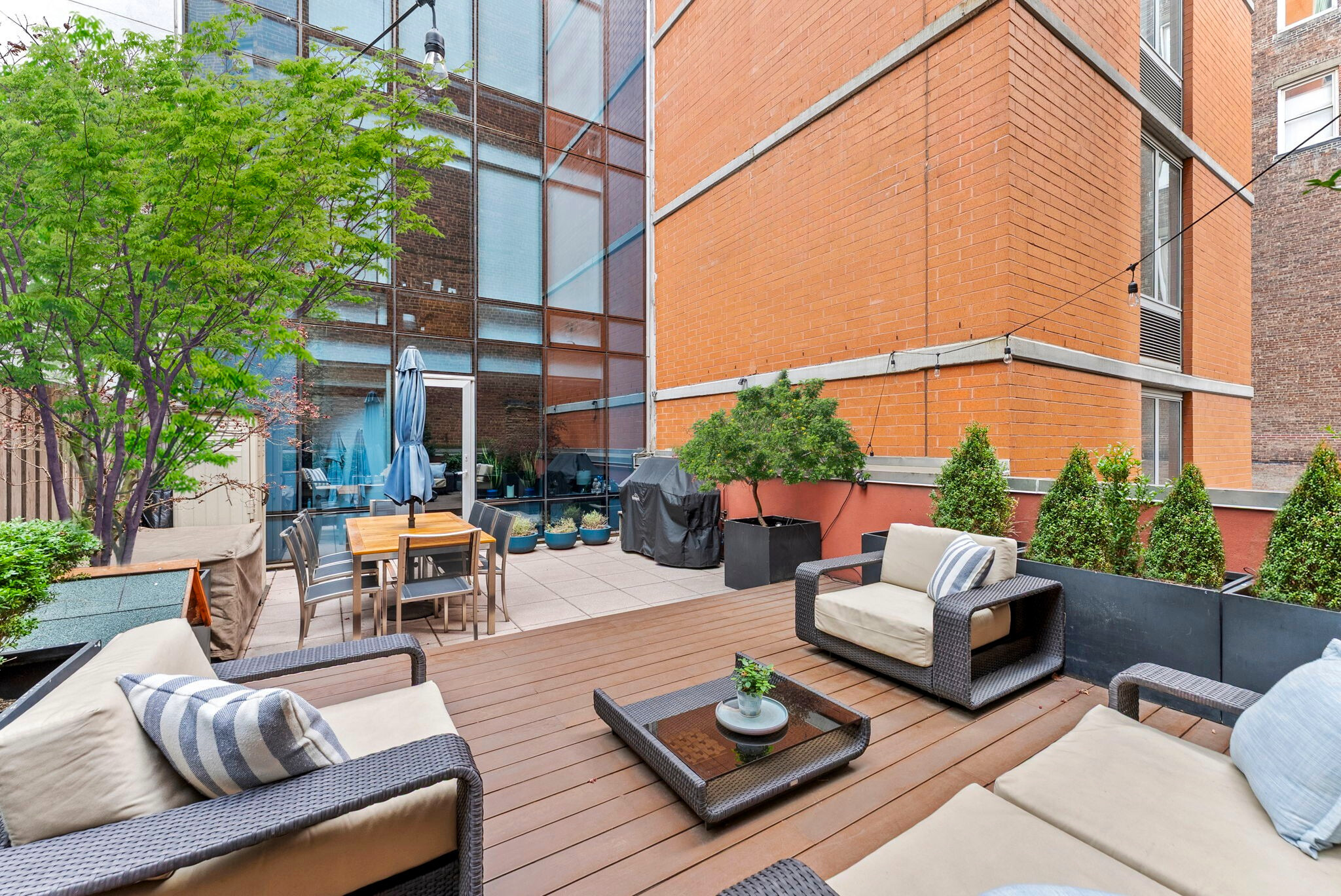 166 West 18th Street, Unit 2D Manhattan, NY 10011 - Photo 1 of 17 a view of a patio with couches table and chairs and potted plants