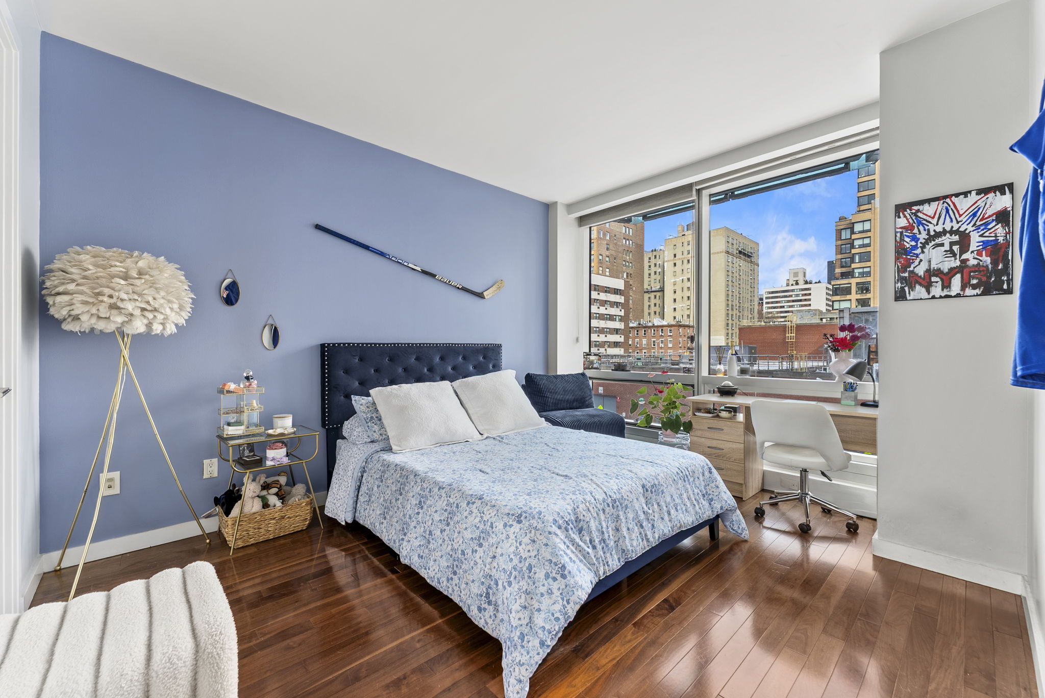 166 West 18th Street, Unit 2D Manhattan, NY 10011 - Photo 11 of 17 a bedroom with a bed a chair and a large window