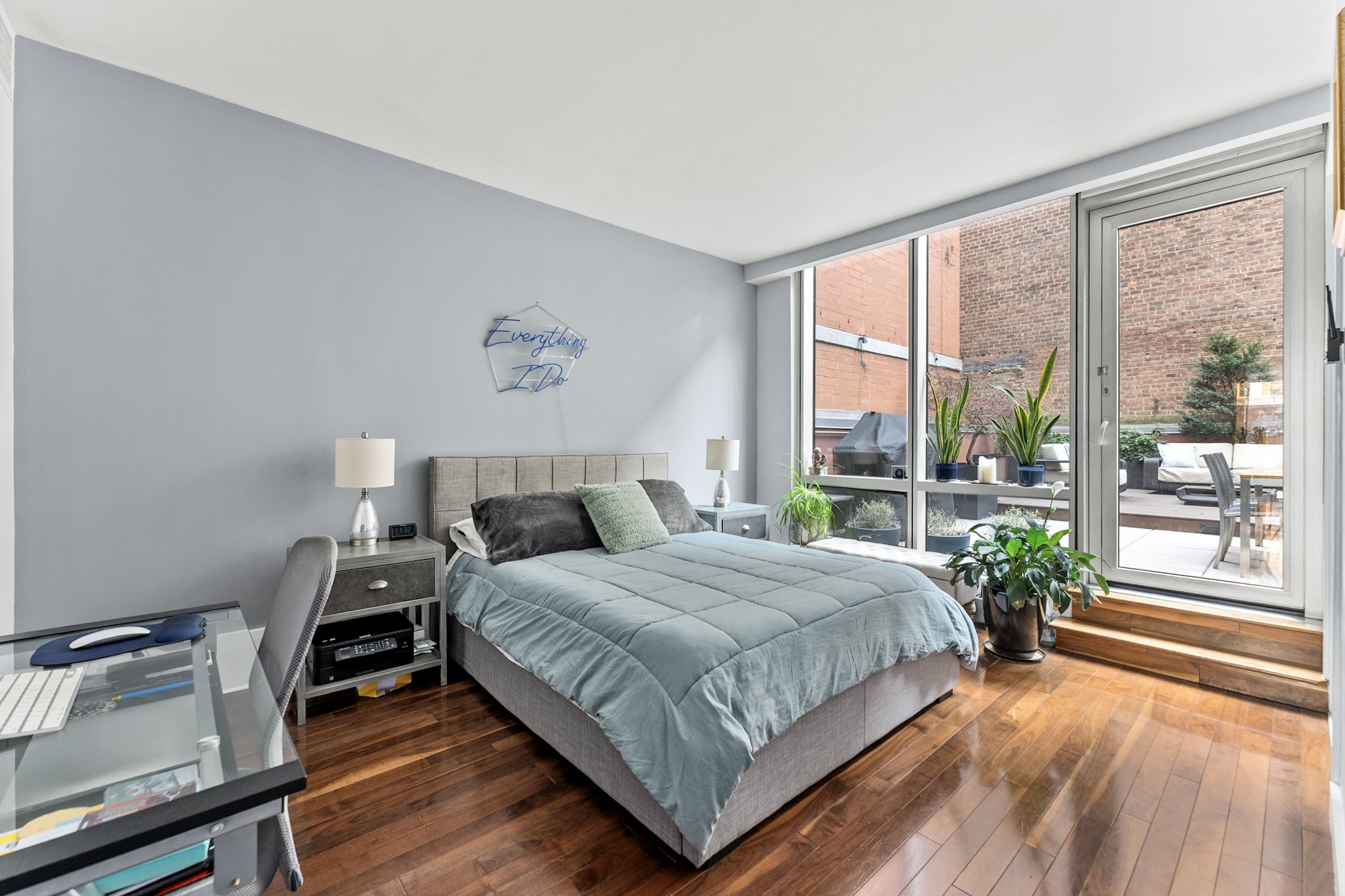 166 West 18th Street, Unit 2D Manhattan, NY 10011 - Photo 7 of 17 a bedroom with a bed and a large window