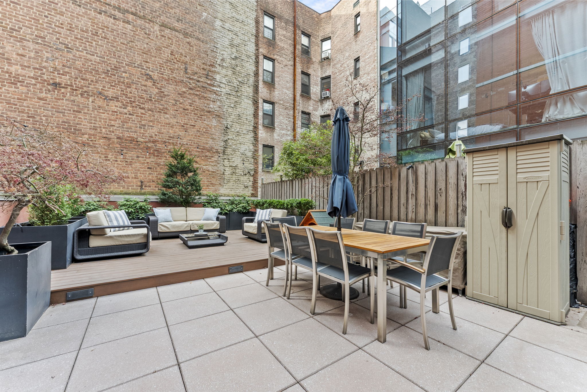 166 West 18th Street, Unit 2D Manhattan, NY 10011 - Photo 8 of 17 a view of a patio with table and chairs and potted plants