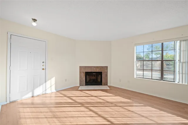 a bedroom with a bed and a fireplace