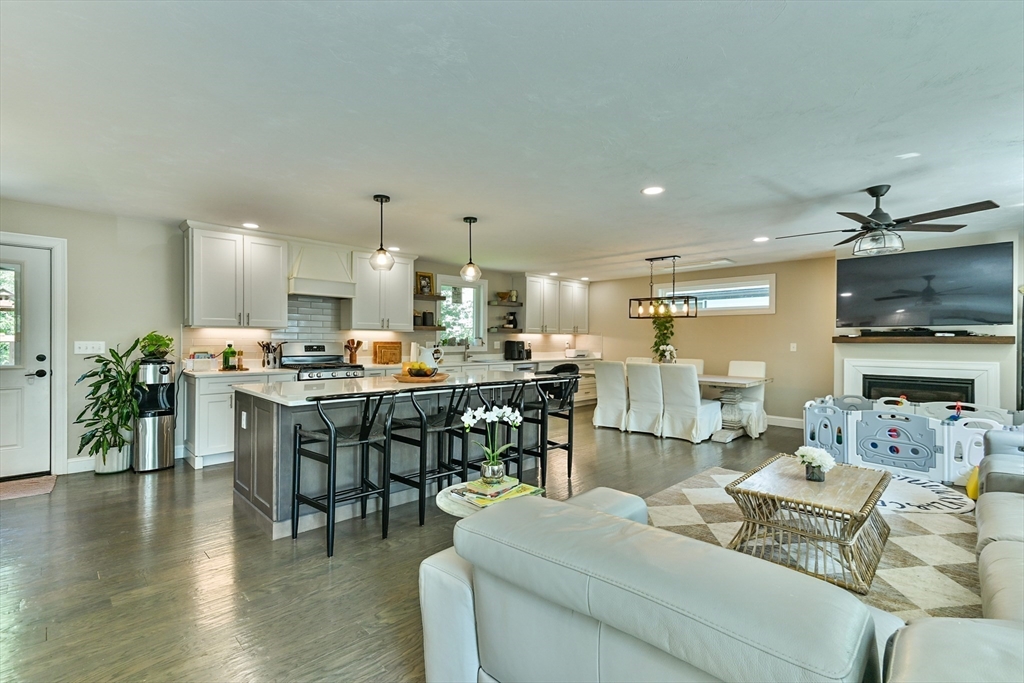 20 Lakeview Road Webster, MA 01570 - Photo 14 of 42 a living room with furniture kitchen view and a wooden floor