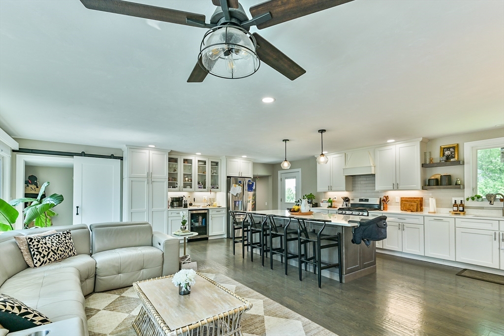 20 Lakeview Road Webster, MA 01570 - Photo 16 of 42 a living room with furniture kitchen view and a wooden floor