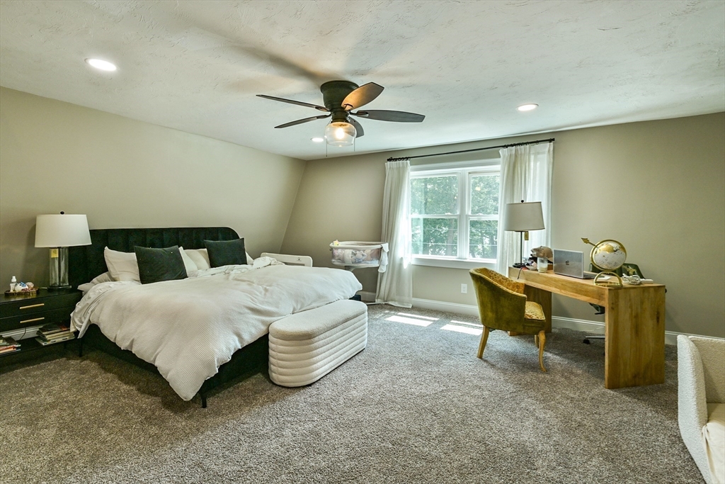 20 Lakeview Road Webster, MA 01570 - Photo 30 of 42 a bedroom with a bed and a table