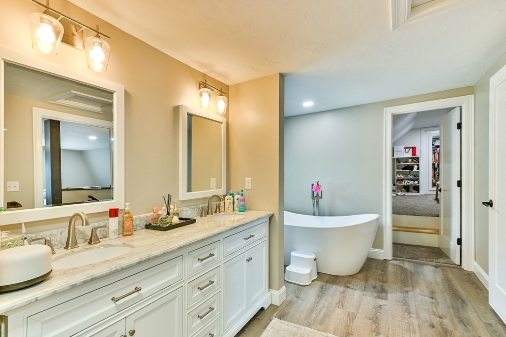 20 Lakeview Road Webster, MA 01570 - Photo 34 of 42 a bathroom with a granite countertop sink and a mirror