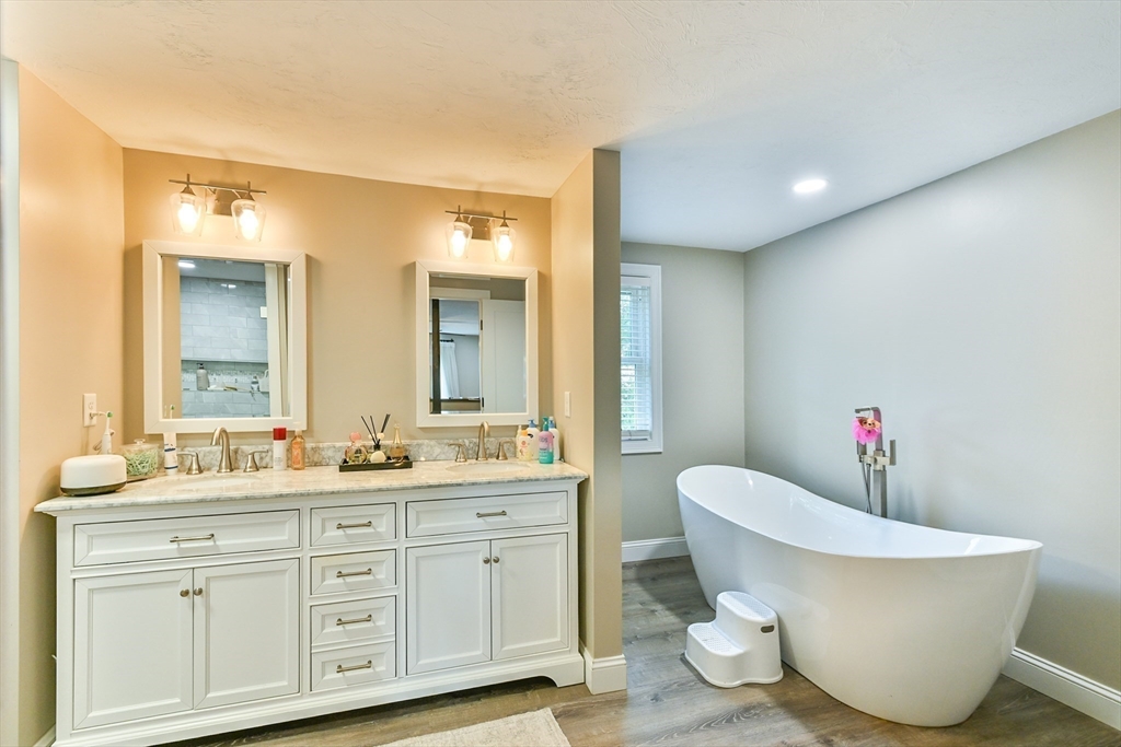 20 Lakeview Road Webster, MA 01570 - Photo 35 of 42 a bathroom with a double vanity sink mirror and bathtub