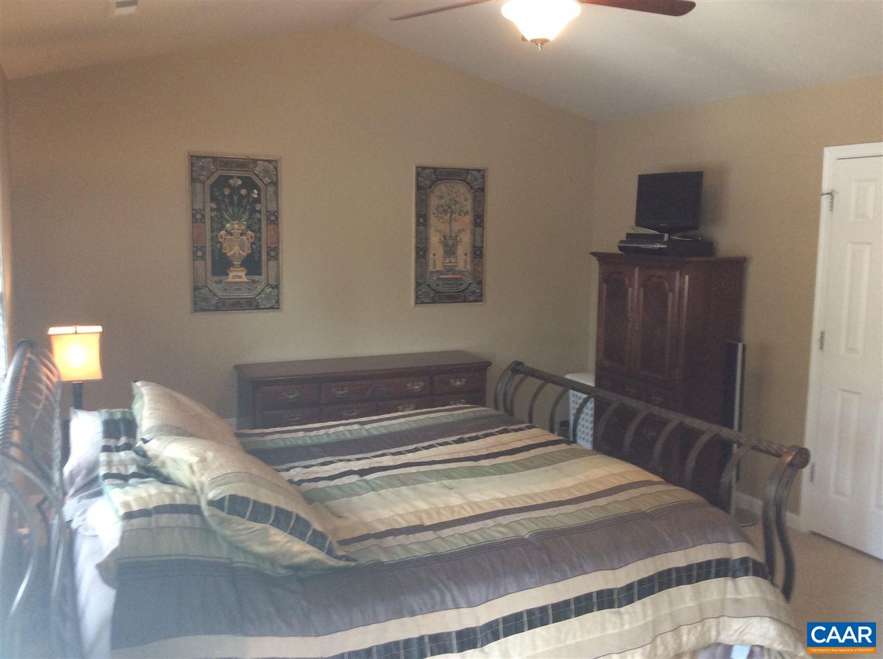 34 Xebec Road Palmyra, VA 22963 - Photo 11 of 28 a bedroom with a bed and wooden floor