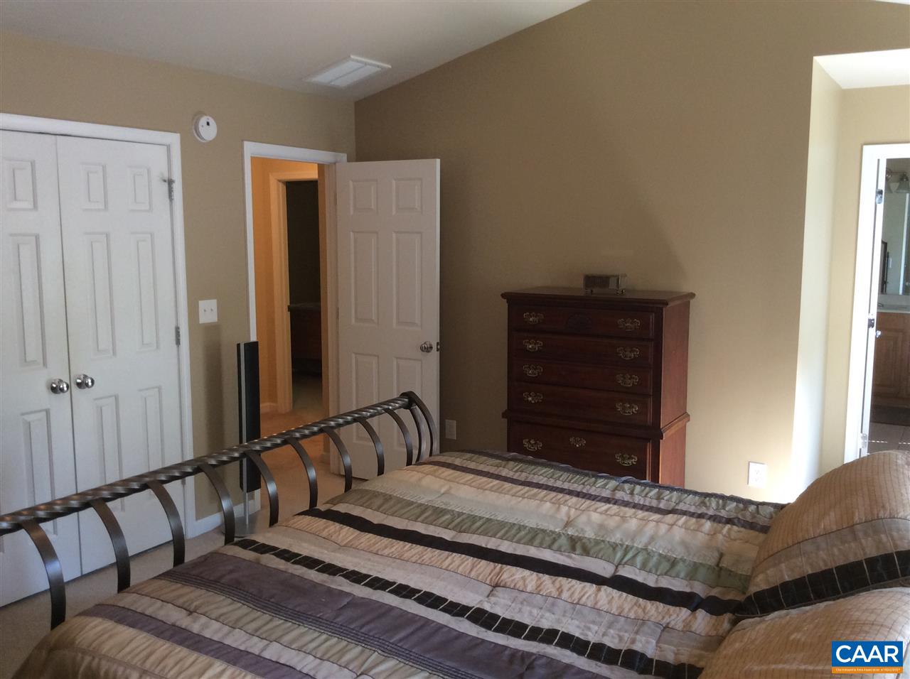 34 Xebec Road Palmyra, VA 22963 - Photo 12 of 28 a bedroom with a bed and wooden floor