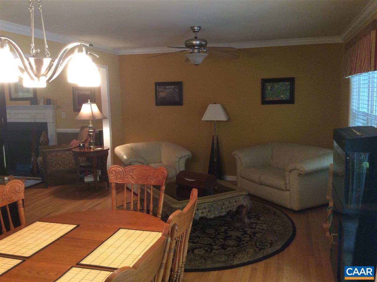 34 Xebec Road Palmyra, VA 22963 - Photo 23 of 28 a living room with furniture and a chandelier