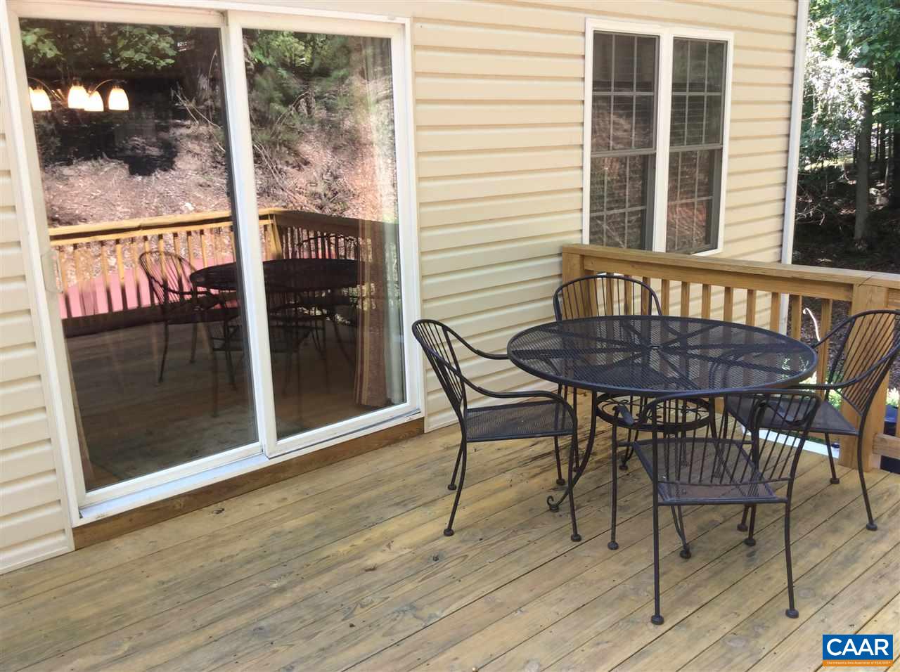 34 Xebec Road Palmyra, VA 22963 - Photo 25 of 28 a view of a dining room with wooden floor and a window