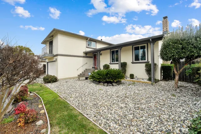 a front view of a house with a yard