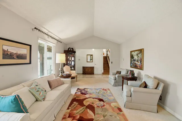 a living room with furniture and a couch