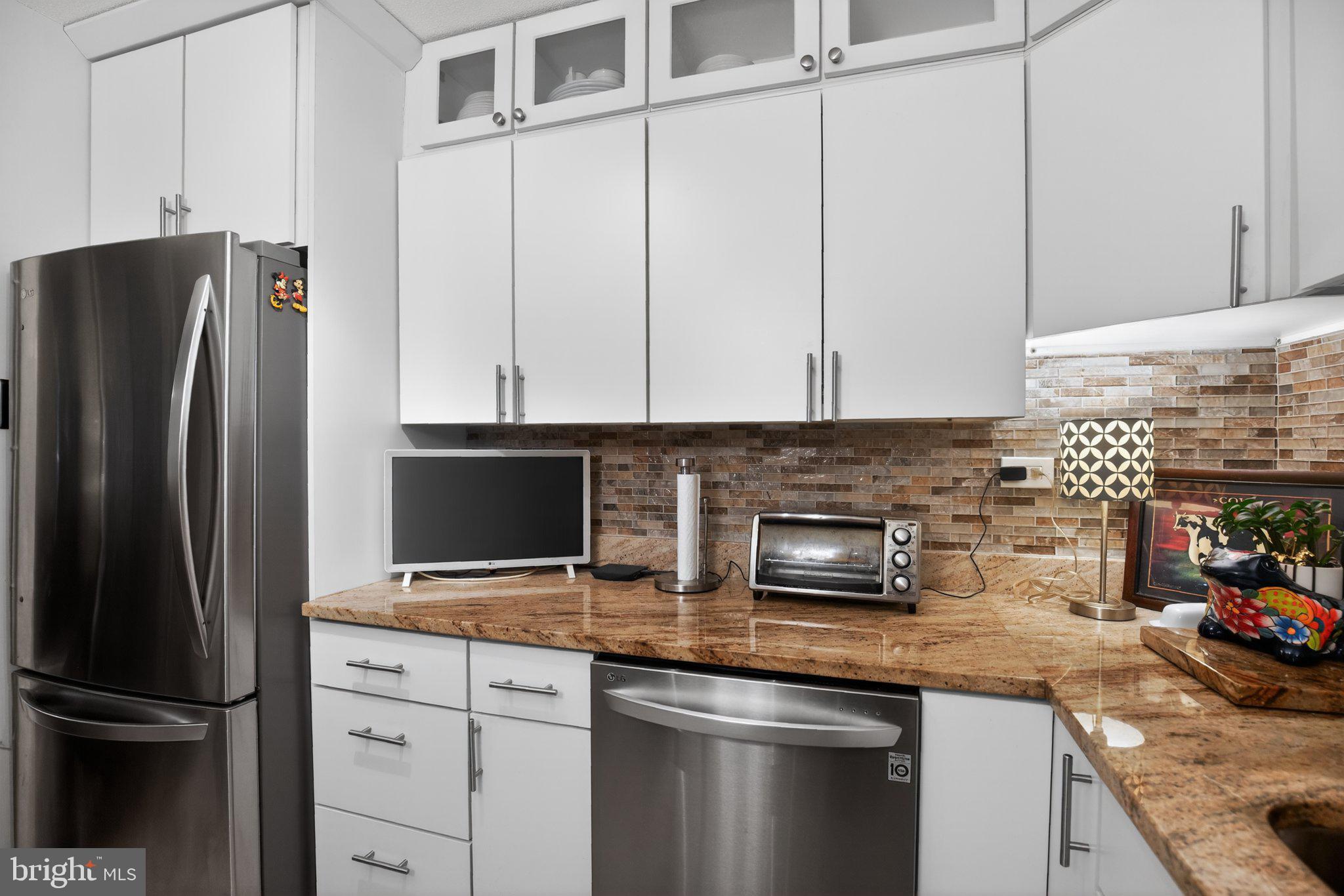 700 7th Street Southwest, Unit 526 Washington, DC 20024 - Photo 13 of 33 Sleek modern kitchen with elegant finishes.