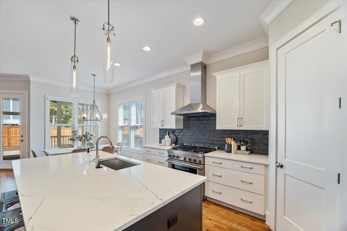 6152 Blanche Drive Raleigh, NC 27607 - Photo 14 of 47 a kitchen with appliances a sink and cabinets