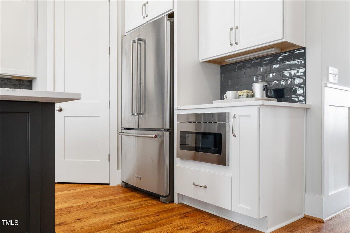 6152 Blanche Drive Raleigh, NC 27607 - Photo 18 of 47 a view of kitchen with stainless steel appliances cabinets and a window