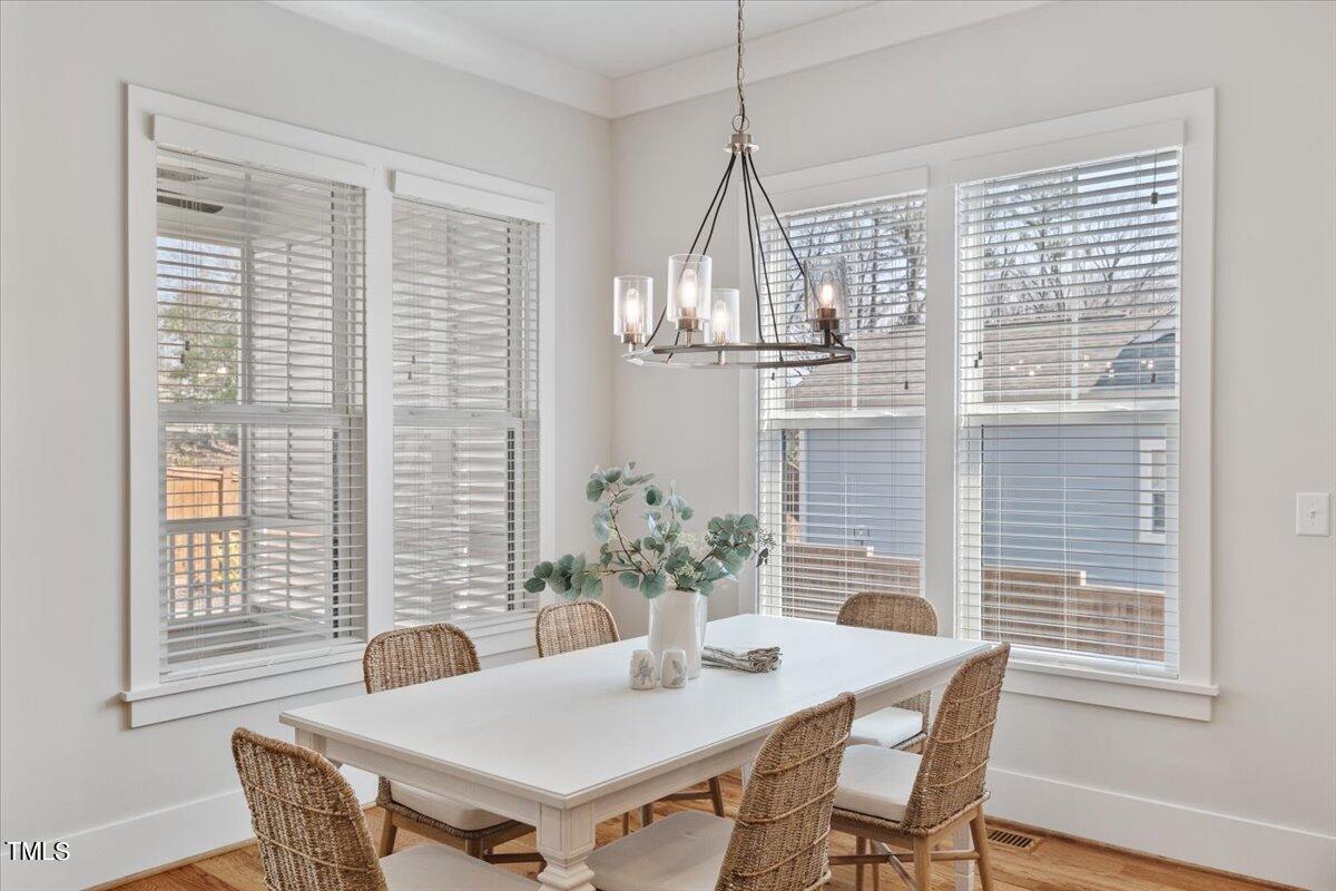 6152 Blanche Drive Raleigh, NC 27607 - Photo 19 of 47 a view of a dining room with furniture and window