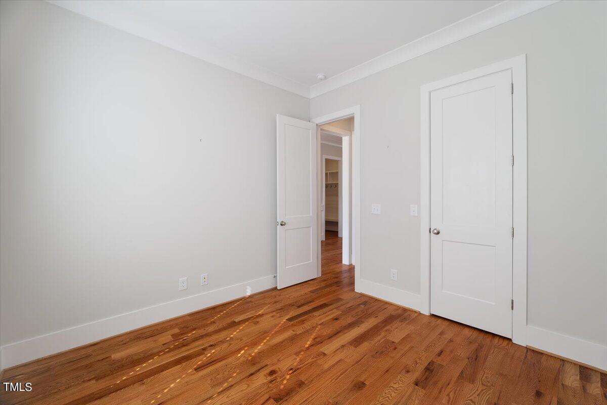 6152 Blanche Drive Raleigh, NC 27607 - Photo 30 of 47 a view of empty room with wooden floor