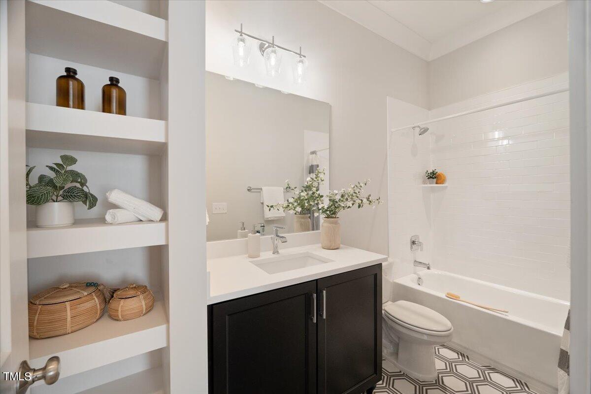 6152 Blanche Drive Raleigh, NC 27607 - Photo 31 of 47 a bathroom with a sink a toilet and shower