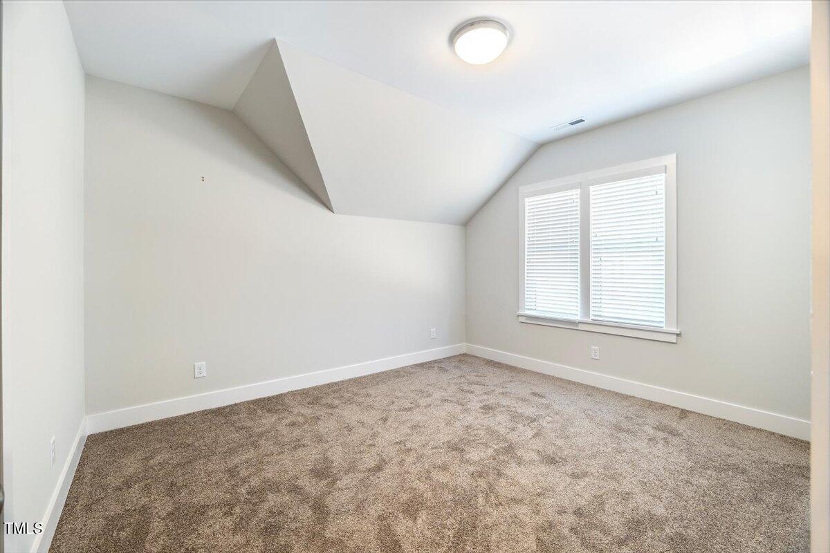 6152 Blanche Drive Raleigh, NC 27607 - Photo 38 of 47 an empty room with a window