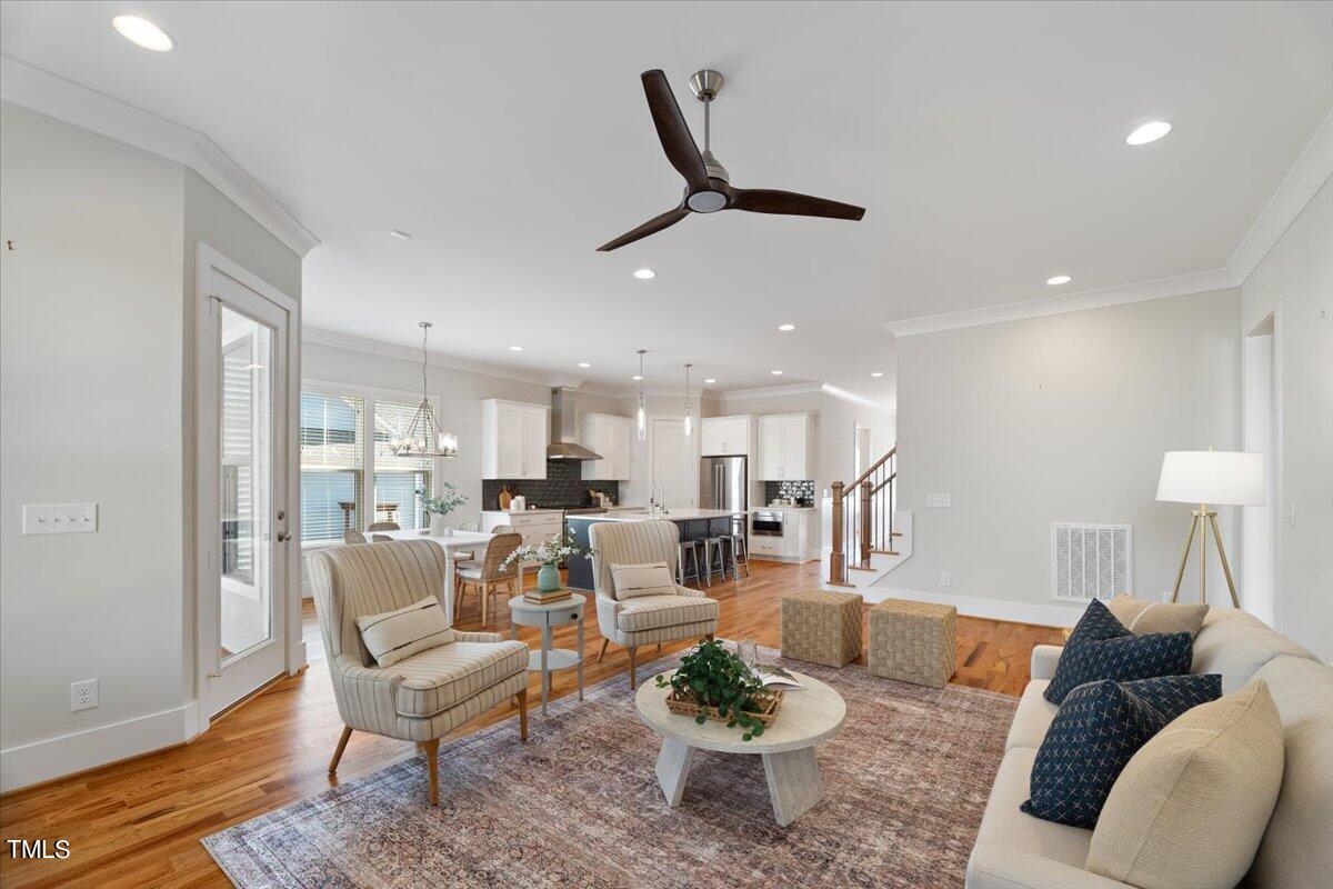 6152 Blanche Drive Raleigh, NC 27607 - Photo 9 of 47 a living room with furniture and a wooden floor