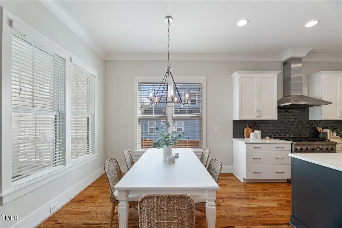 6152 Blanche Drive Raleigh, NC 27607 - Photo 10 of 47 a kitchen with kitchen island a large window in it