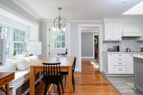 a view of a dining room with furniture window and outside view