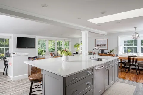 a kitchen with a stove a sink and a refrigerator