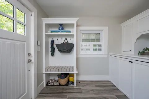 a room that has a window and a wooden floor
