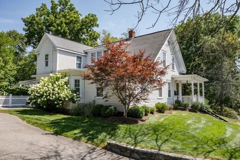 a front view of house with garden