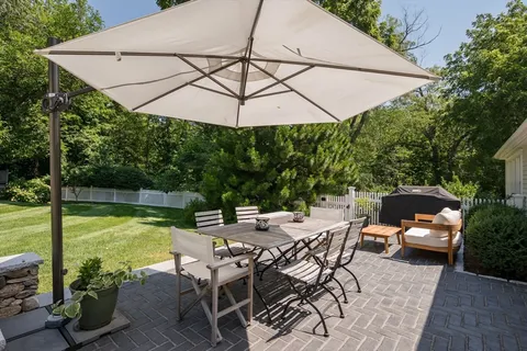 a view of an outdoor sitting area with furniture and backyard