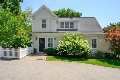 front view of a house next to a yard