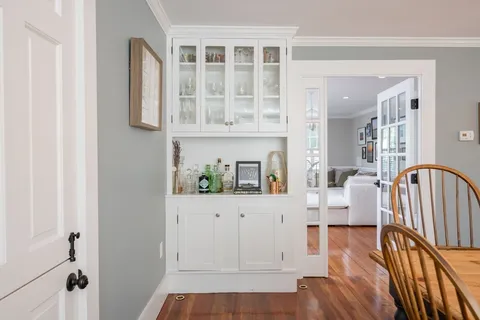 a view of living room and wooden floor