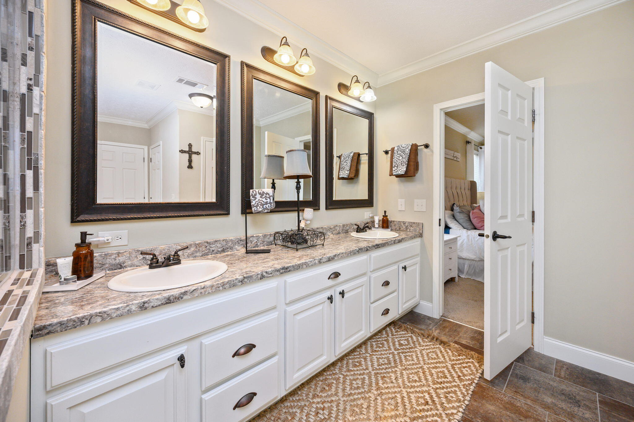 6019 Old River Road Baker, FL 32531 - Photo 20 of 54 a spacious bathroom with double sink and a mirror